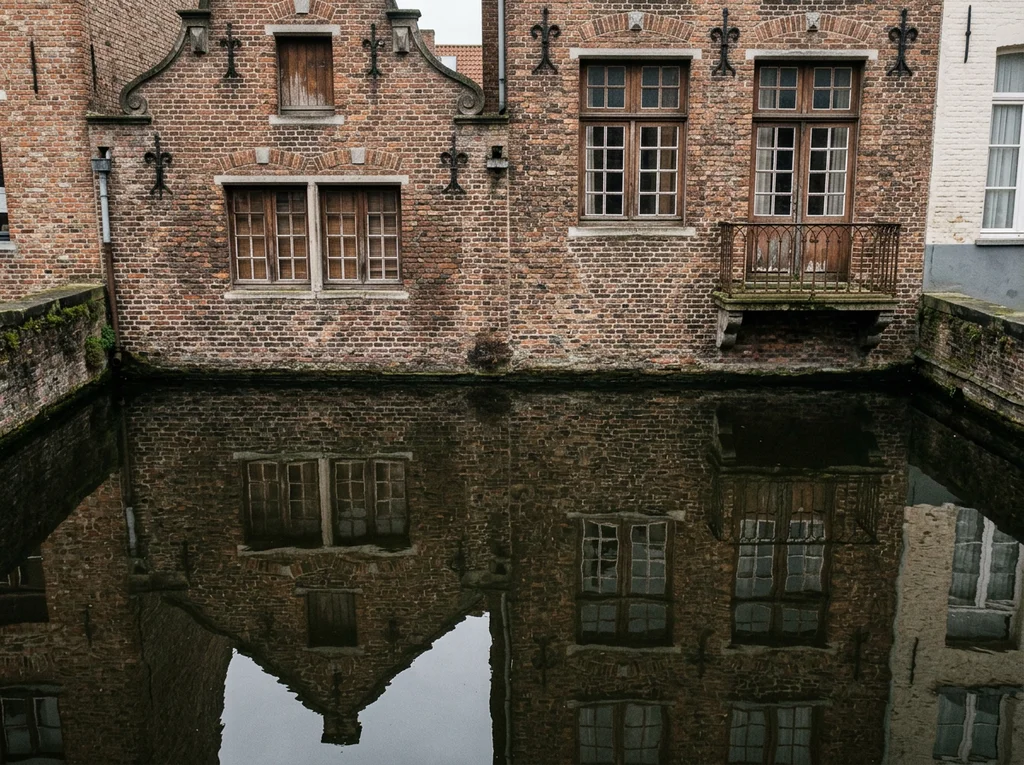 Canal-side building facade and water reflection, representing the Belgium ferry routes
