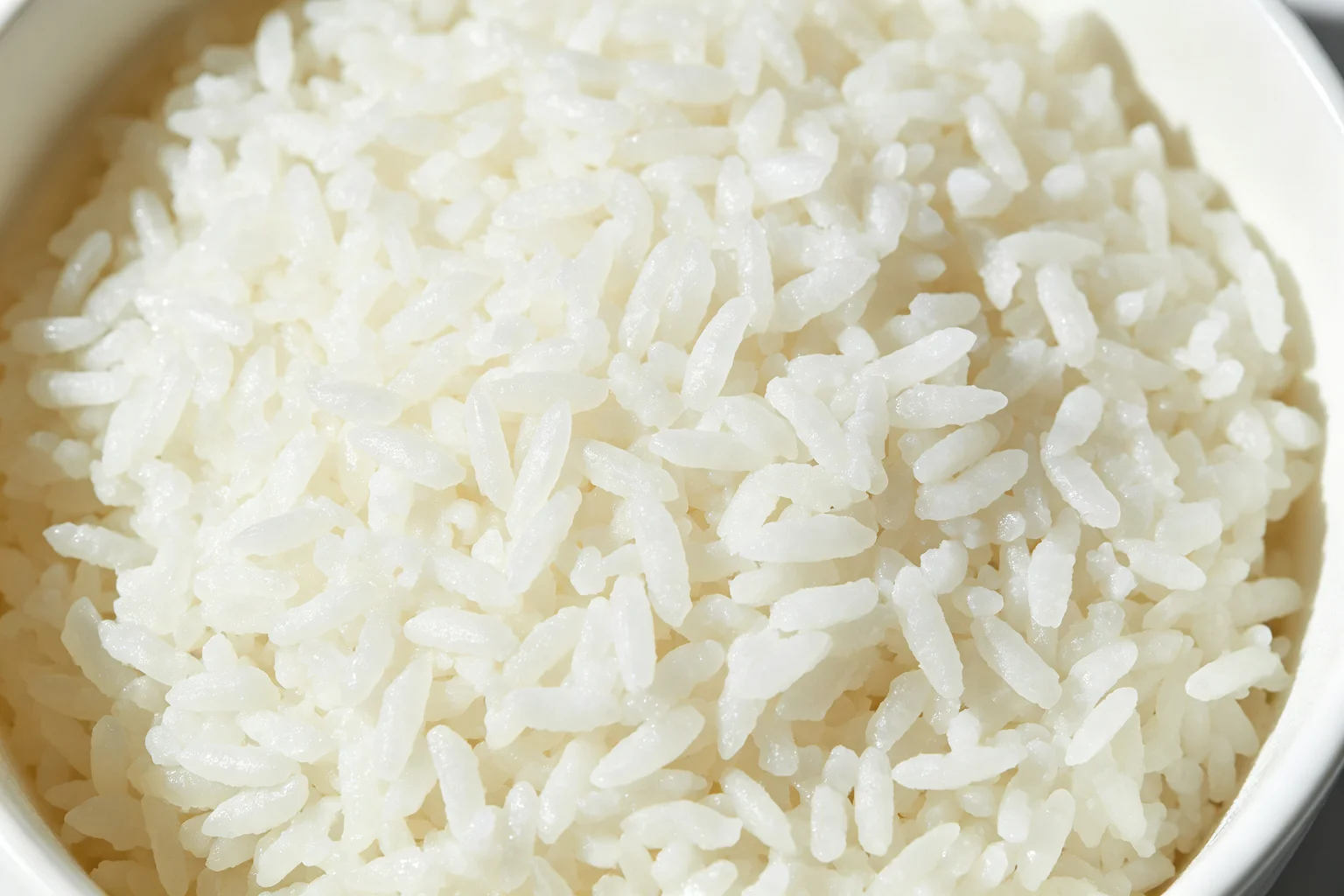 Extreme close-up of dry separated day-old cooked jasmine rice grains